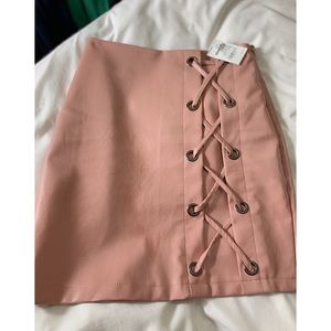 Light pink leather skirt.